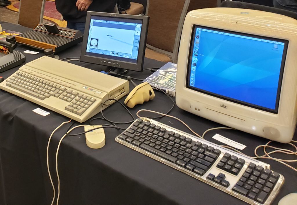 The Falcon 030 (running a flight simulator) and the iMac G3 running an early version of OSX at the 2024 VCF SoCal.