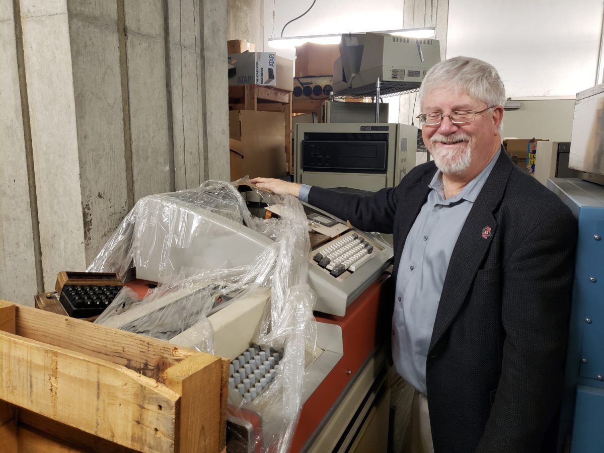 Former CMA acquisitions manager Jim Trageser stands next to the KIM-I kit computer his father built in 1975.